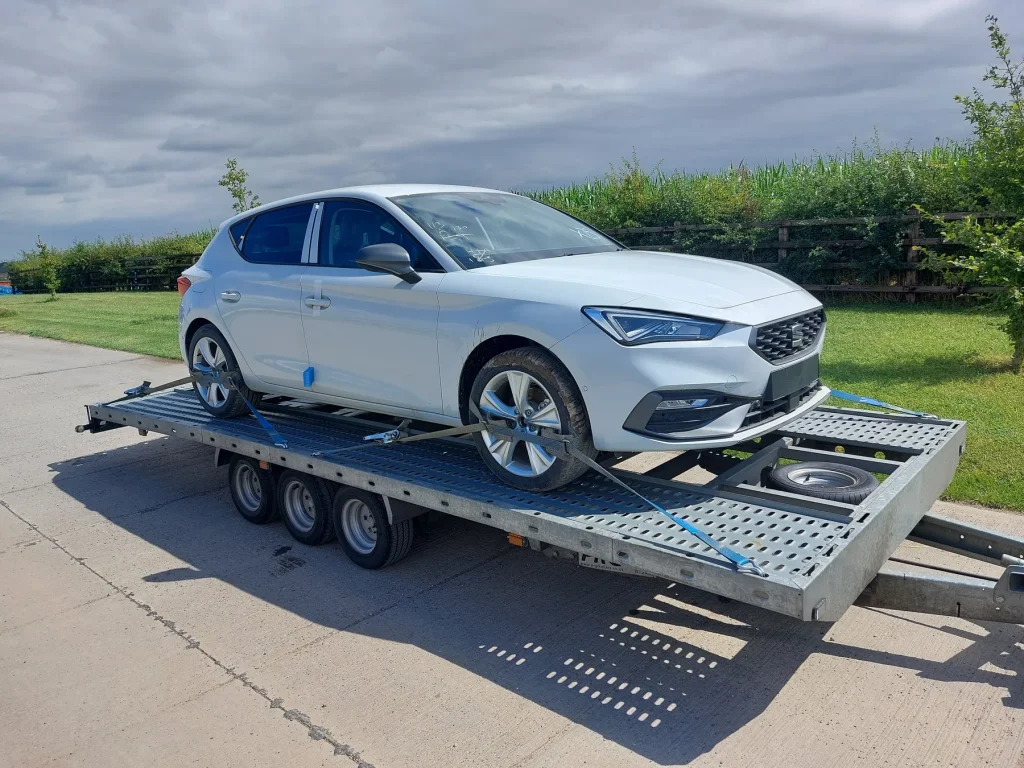 White Cupra Leon vehicle transport by WS Logistics, North West England