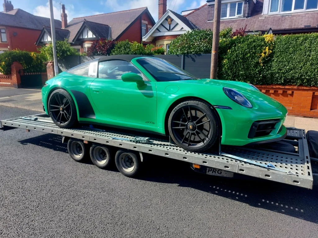 Green Porsche 911 Targa GTS sports car delivery by WS Logistics, North West