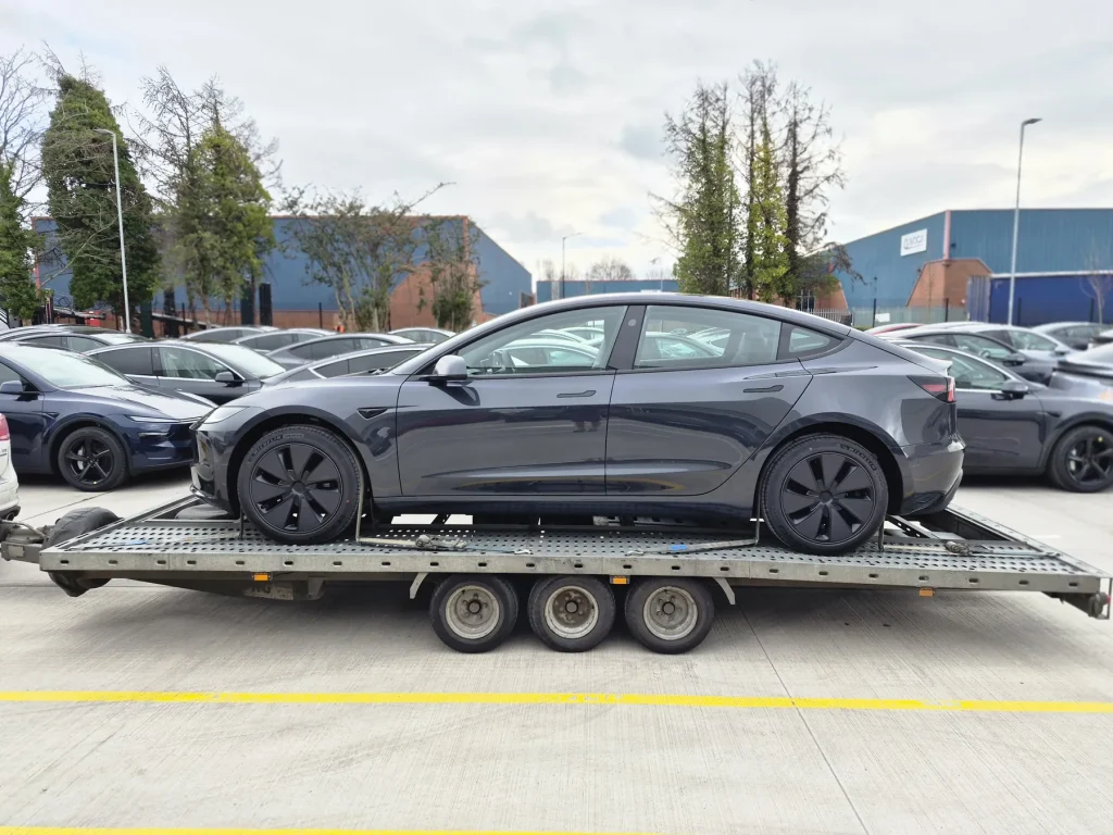 Grey Tesla Model 3 EV transported by WS Logistics, dealer and storage delivery