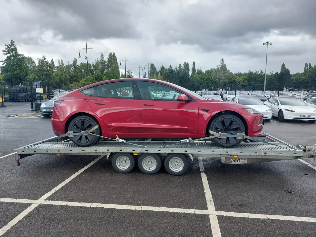 Red Tesla Model 3 on WS Logistics transporter, EV transport Lancashire