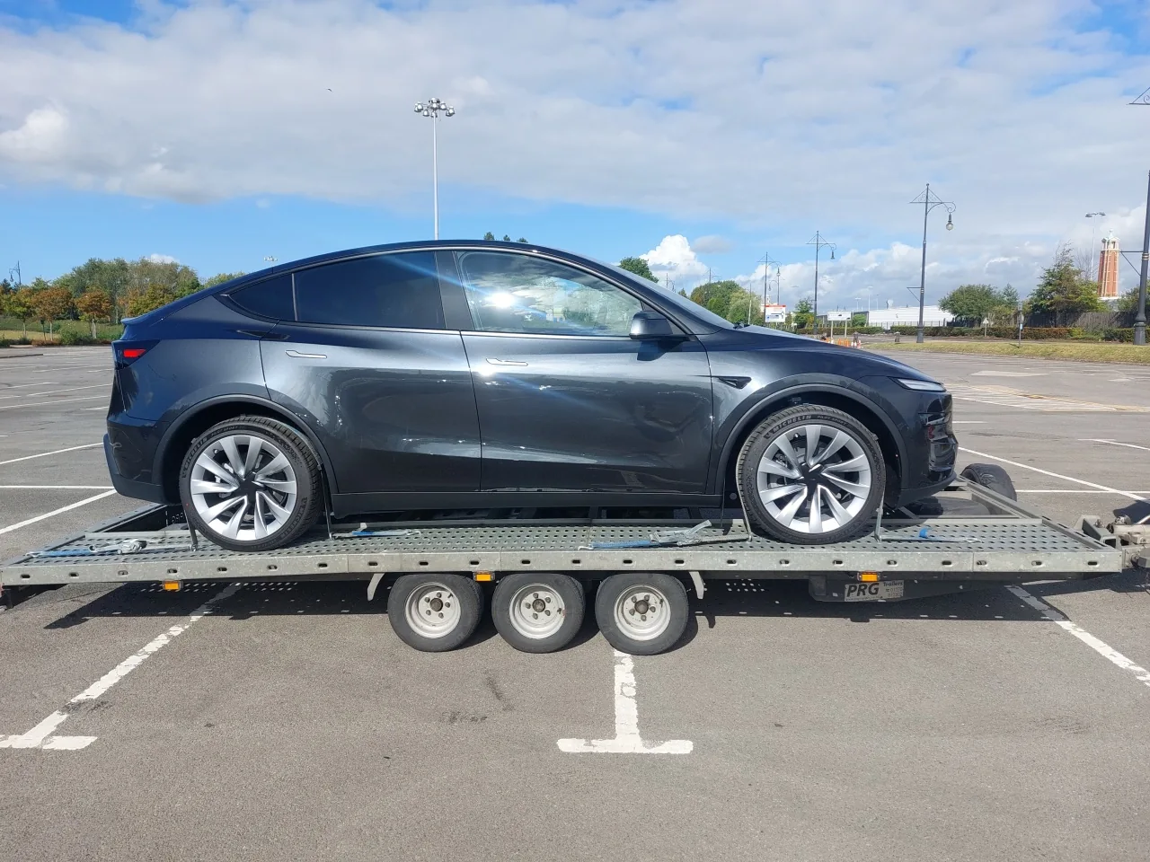 Grey Tesla Model Y electric vehicle transport by WS Logistics, Lancashire and North West