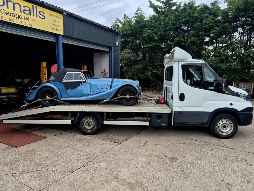 WS Logistics recovery truck winching a classic Morgan onto the bed at Gornalls Garage, Hambleton