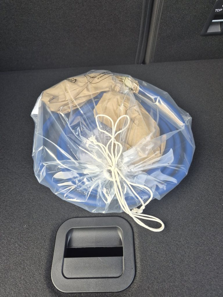 Bagged charging cable in the boot of a new electric Ford Puma Gen-E